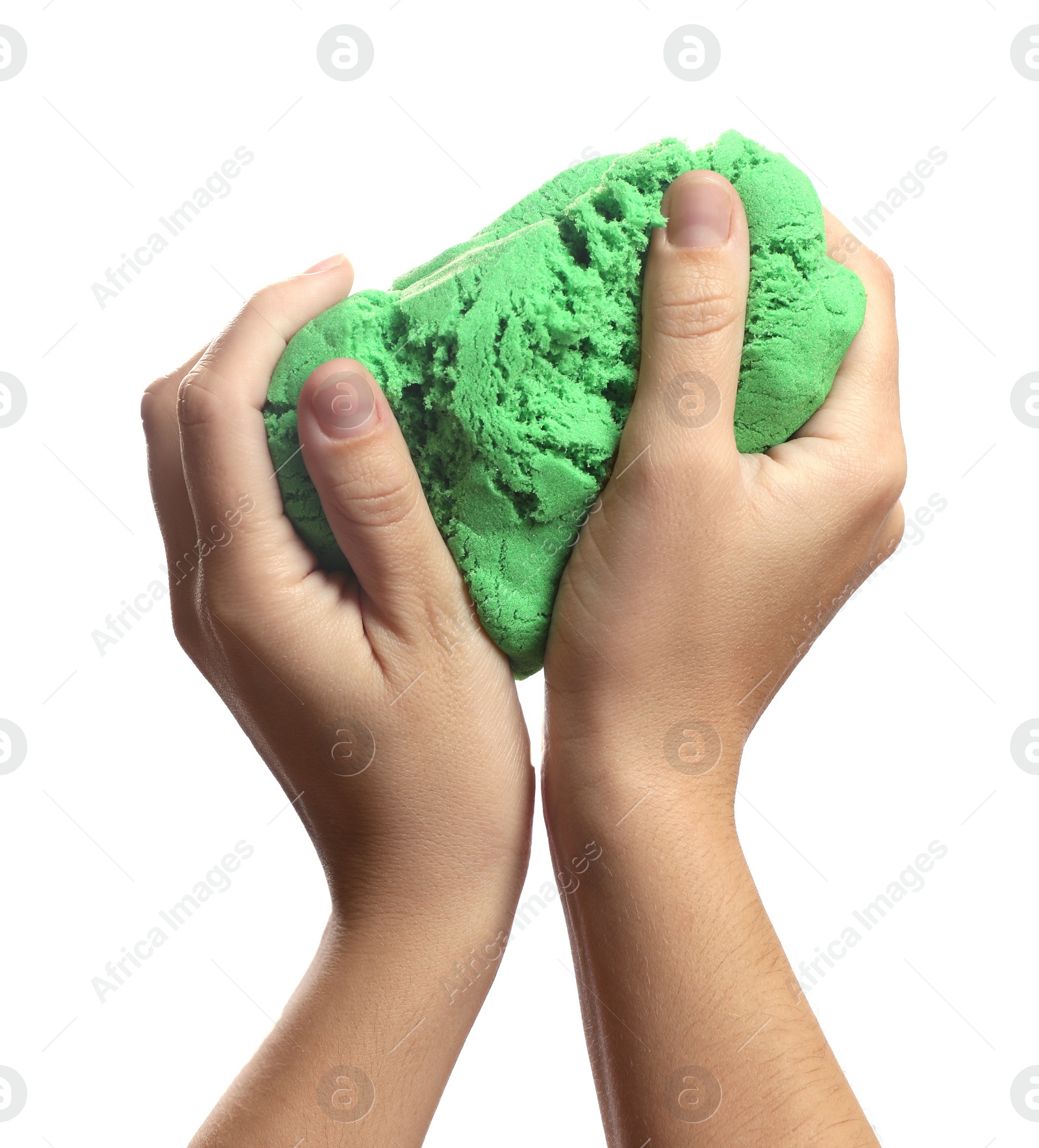 Photo of Woman playing with green kinetic sand on white background, closeup