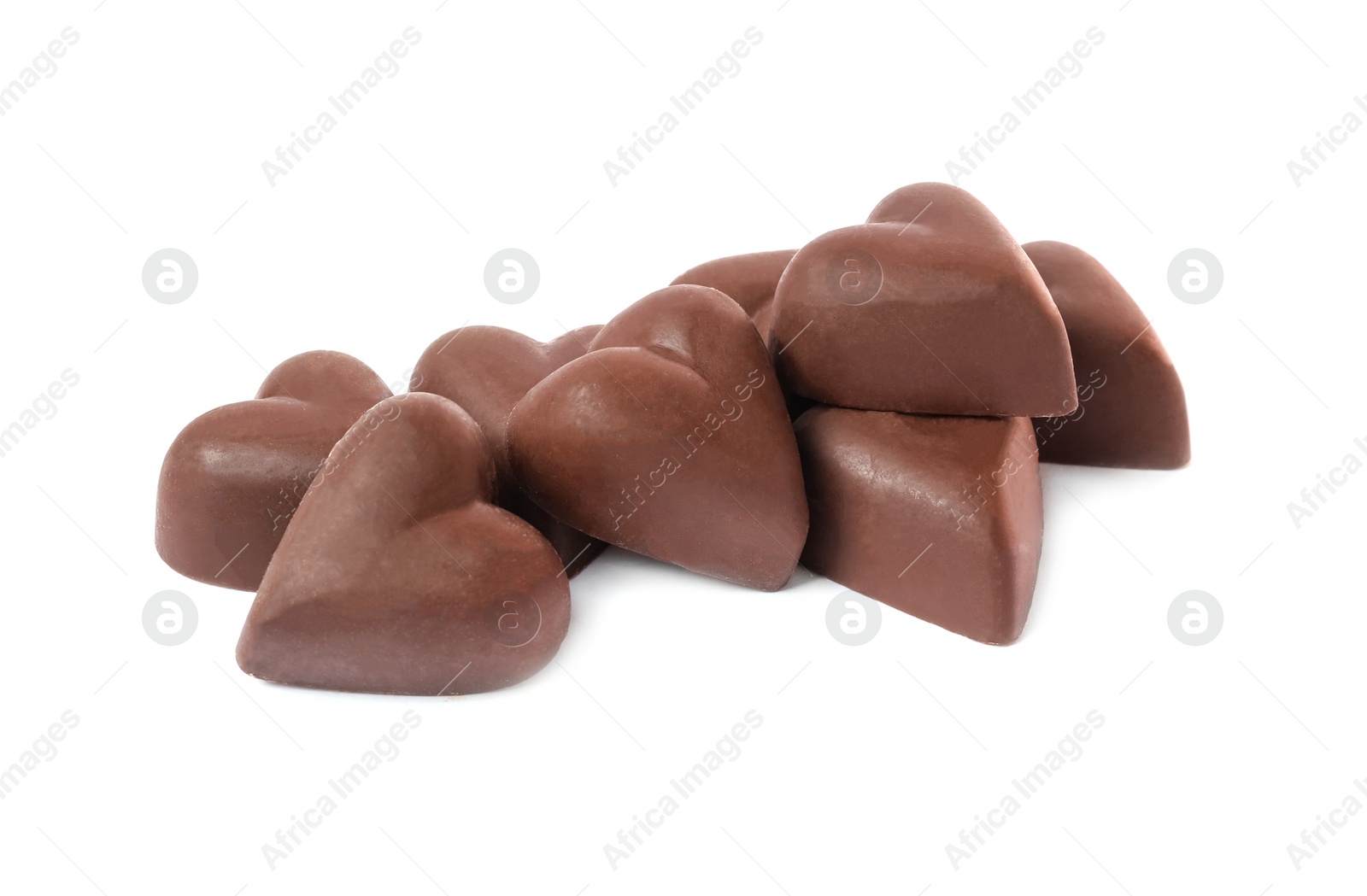 Photo of Delicious heart shaped chocolate candies on white background