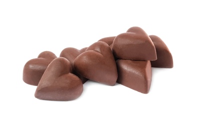 Delicious heart shaped chocolate candies on white background