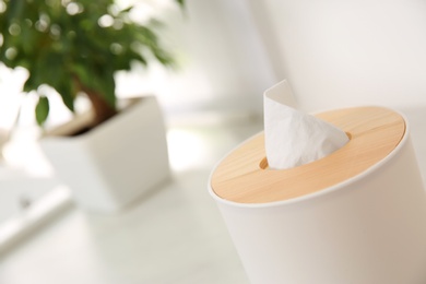 Box with paper tissues on table, closeup. Space for text