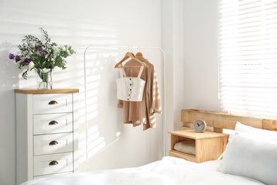 Photo of Stylish bedroom with modern chest of drawers