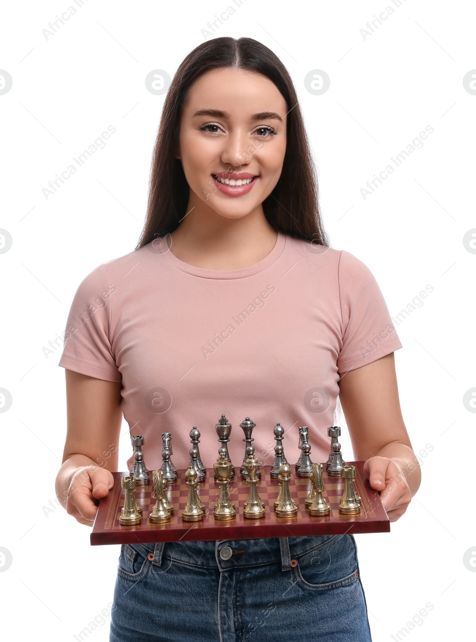 Photo of Happy woman holding chessboard with game pieces white background