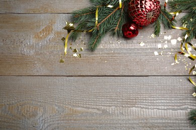 Photo of Happy New Year! Flat lay composition with festive decor on wooden table, space for text
