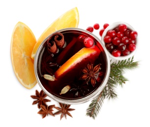 Photo of Aromatic mulled wine and ingredients on white background, top view