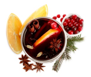 Aromatic mulled wine and ingredients on white background, top view