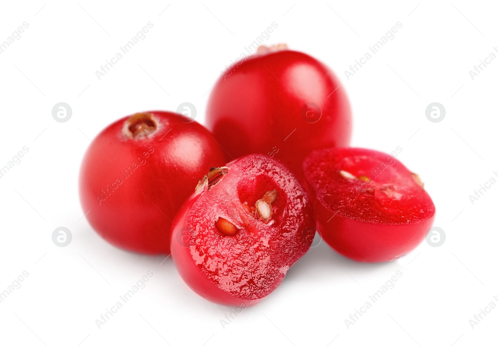 Photo of Fresh cut and whole cranberries on white background