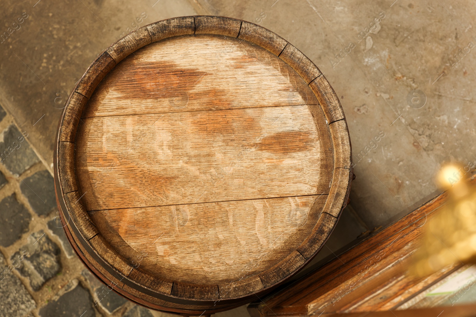 Photo of Traditional wooden barrel outdoors, top view. Wine making