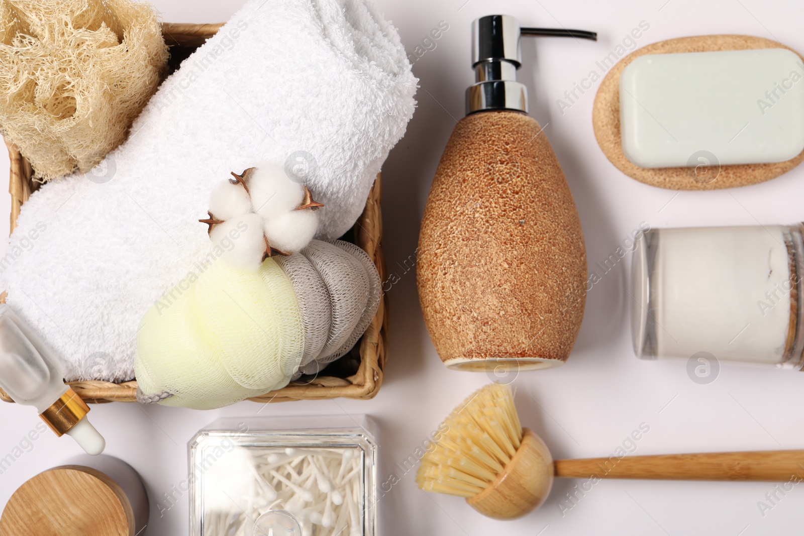 Photo of Bath accessories. Different personal care products and cotton flower on white background, flat lay