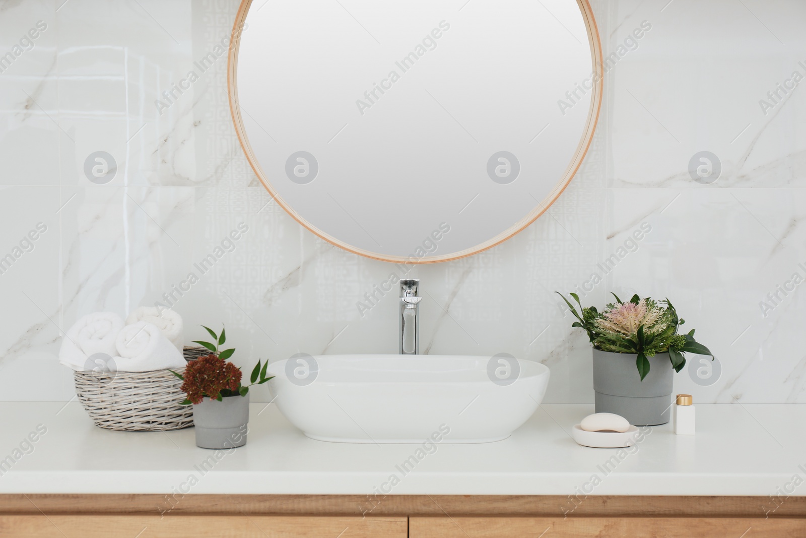 Photo of Modern bathroom interior with stylish mirror and vessel sink