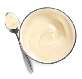 Ceramic bowl and spoon with mayonnaise on white background