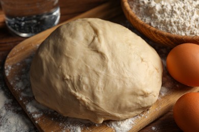 Cooking scones with soda water. Dough and ingredients on wooden table, closeup