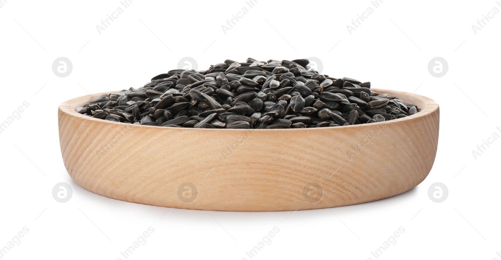 Photo of Plate of sunflower seeds isolated on white