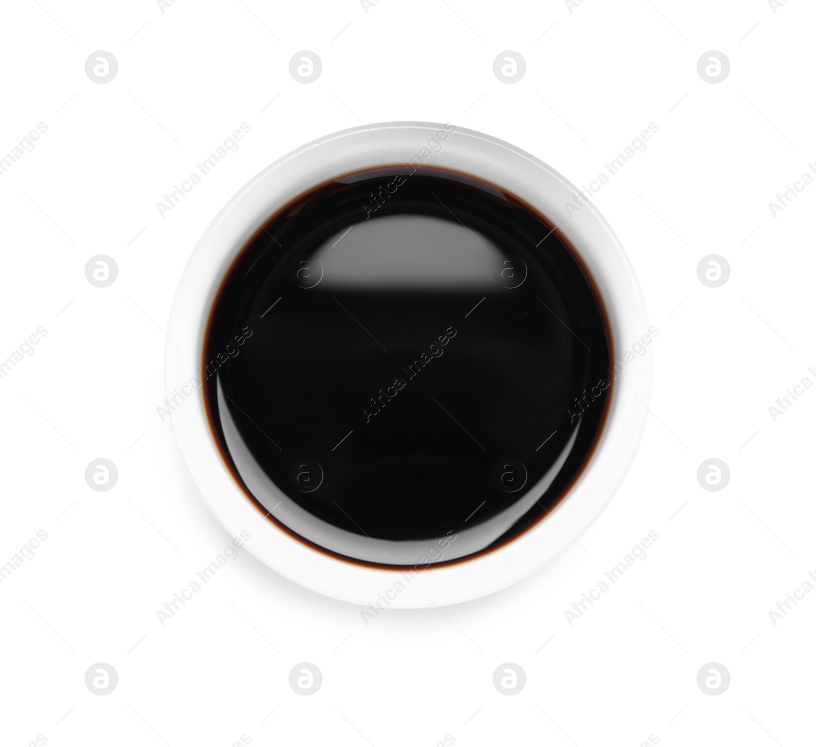Photo of Soy sauce in bowl isolated on white, top view