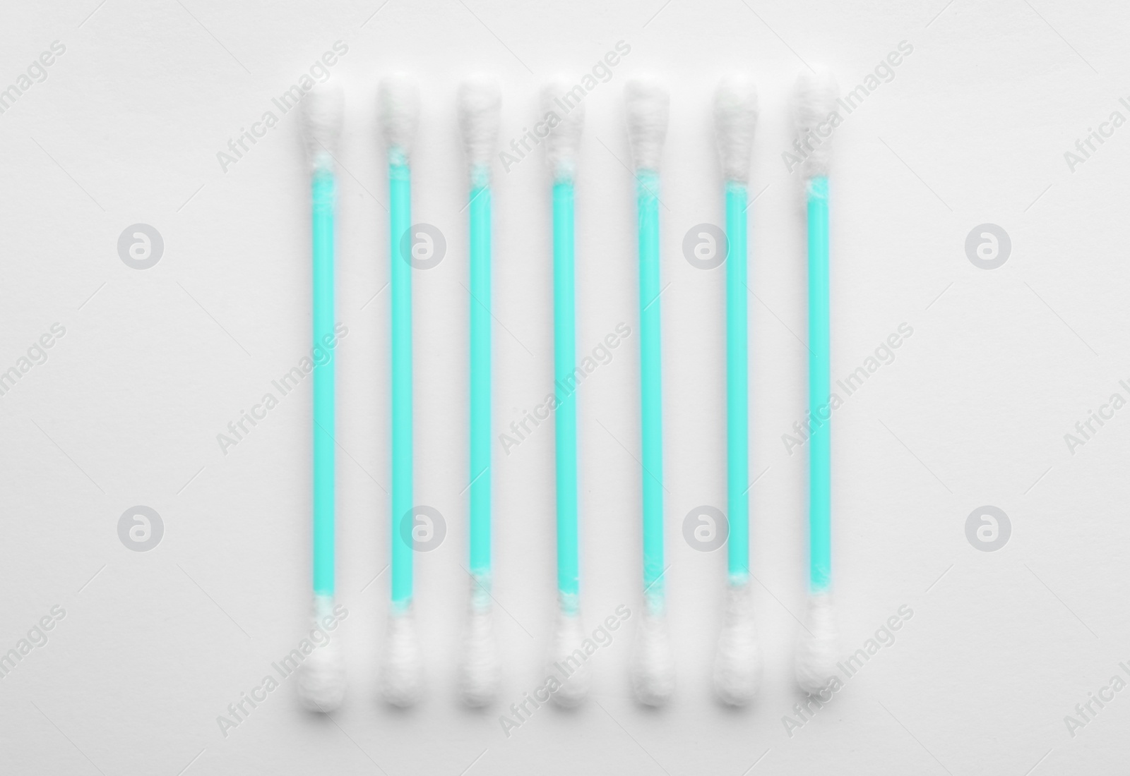 Photo of Plastic cotton swabs on white background, top view