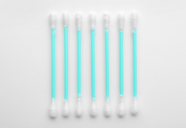 Photo of Plastic cotton swabs on white background, top view