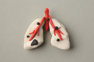 Photo of Human lungs made of plasticine on light grey background, top view. Respiratory disease concept