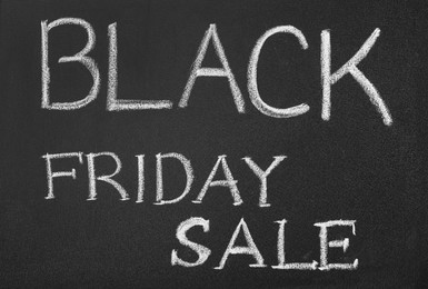 Photo of Words Black Friday Sale written on chalkboard, top view