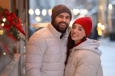 Photo of Lovely couple spending time together on city street