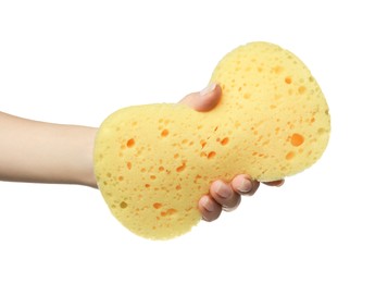 Woman holding new yellow sponge on white background, closeup