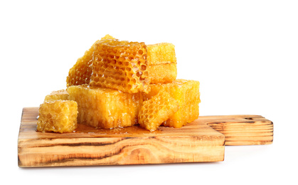 Photo of Board with fresh honeycombs isolated on white