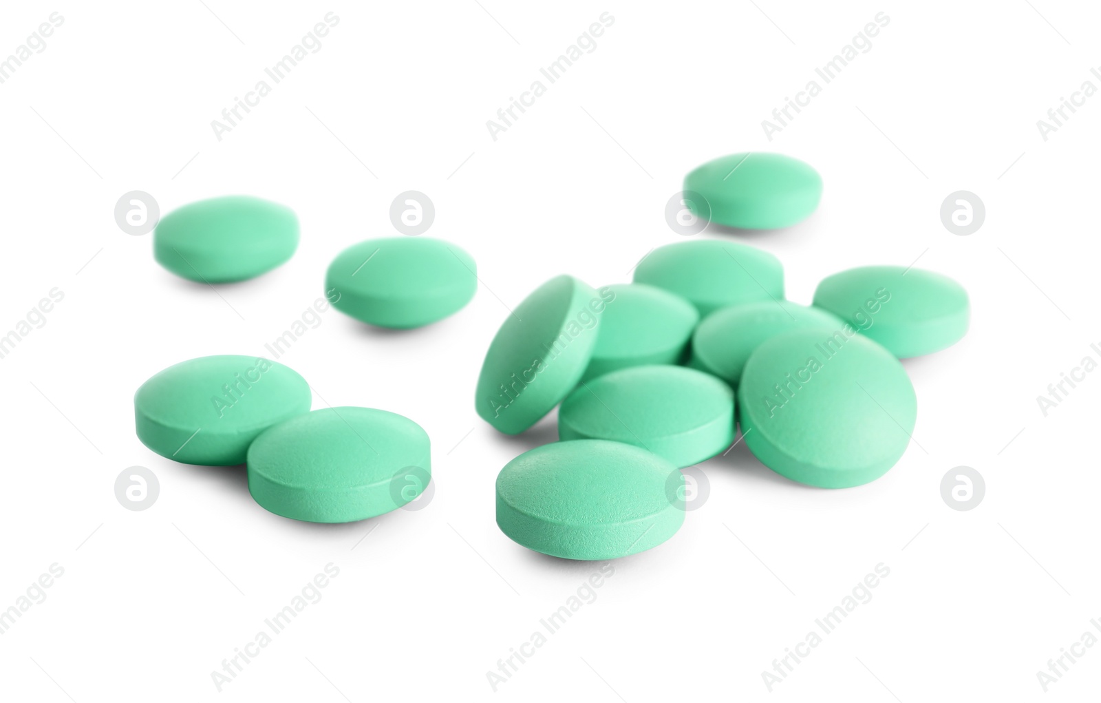 Photo of Many light green pills isolated on white