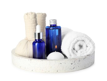 Photo of Spa composition. Bottles of cosmetic products, towel, herbal bags and burning candle isolated on white