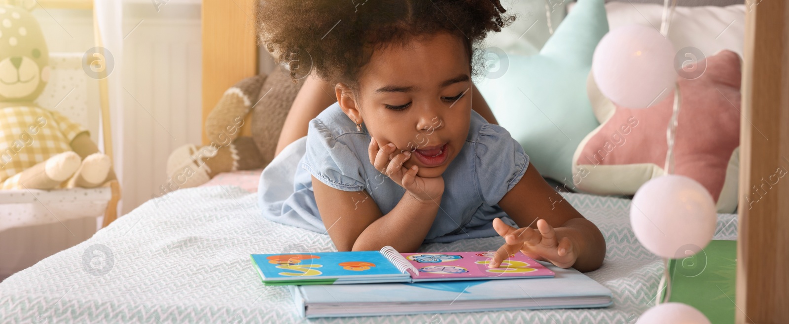 Image of African American girl reading book at home. Banner design