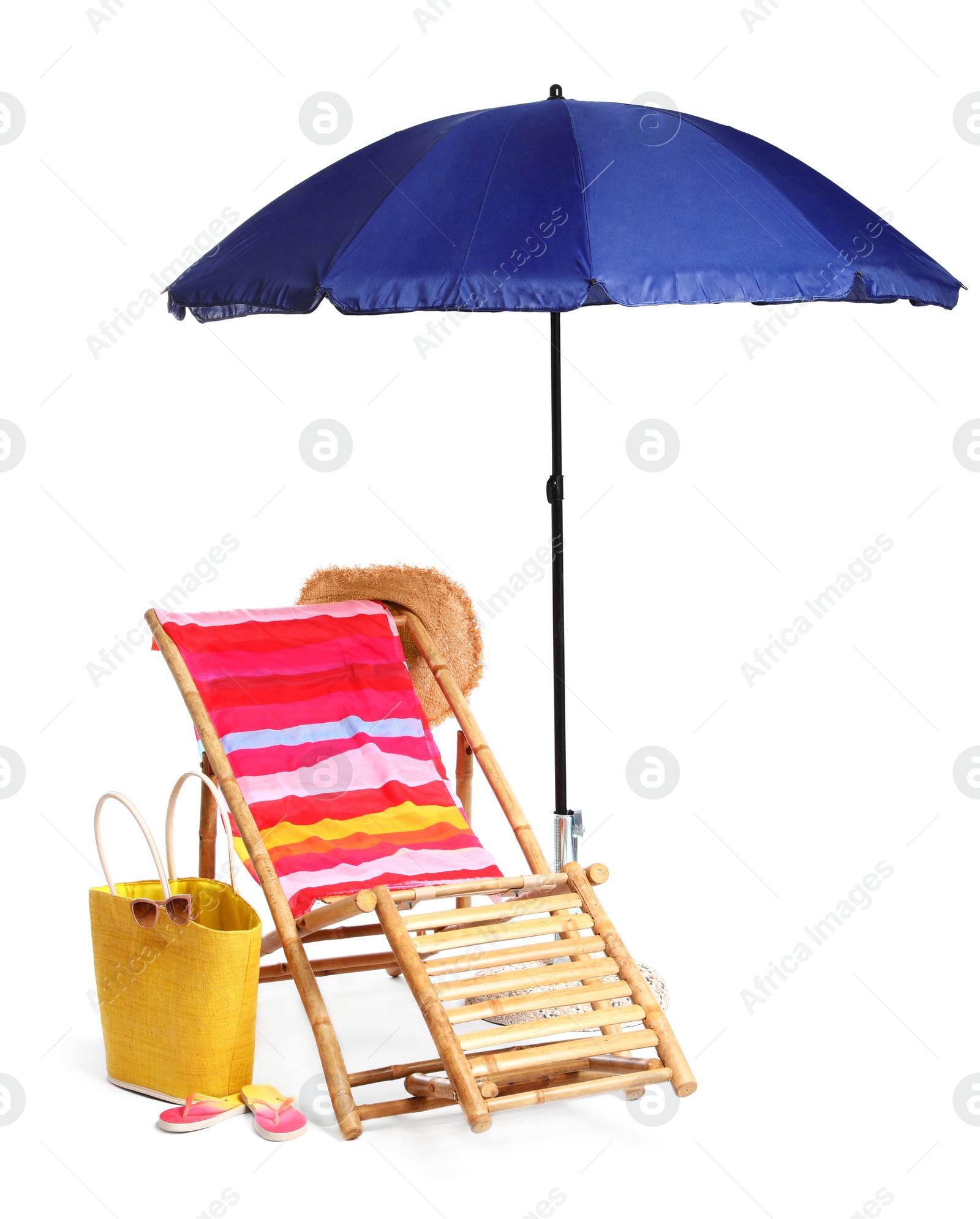 Photo of Wooden sunbed with beach accessories on white background