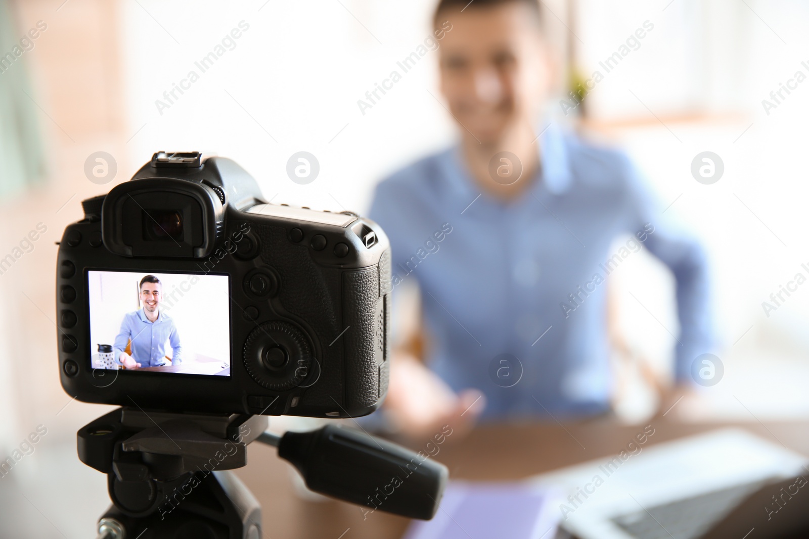 Photo of Male blogger on camera screen, closeup