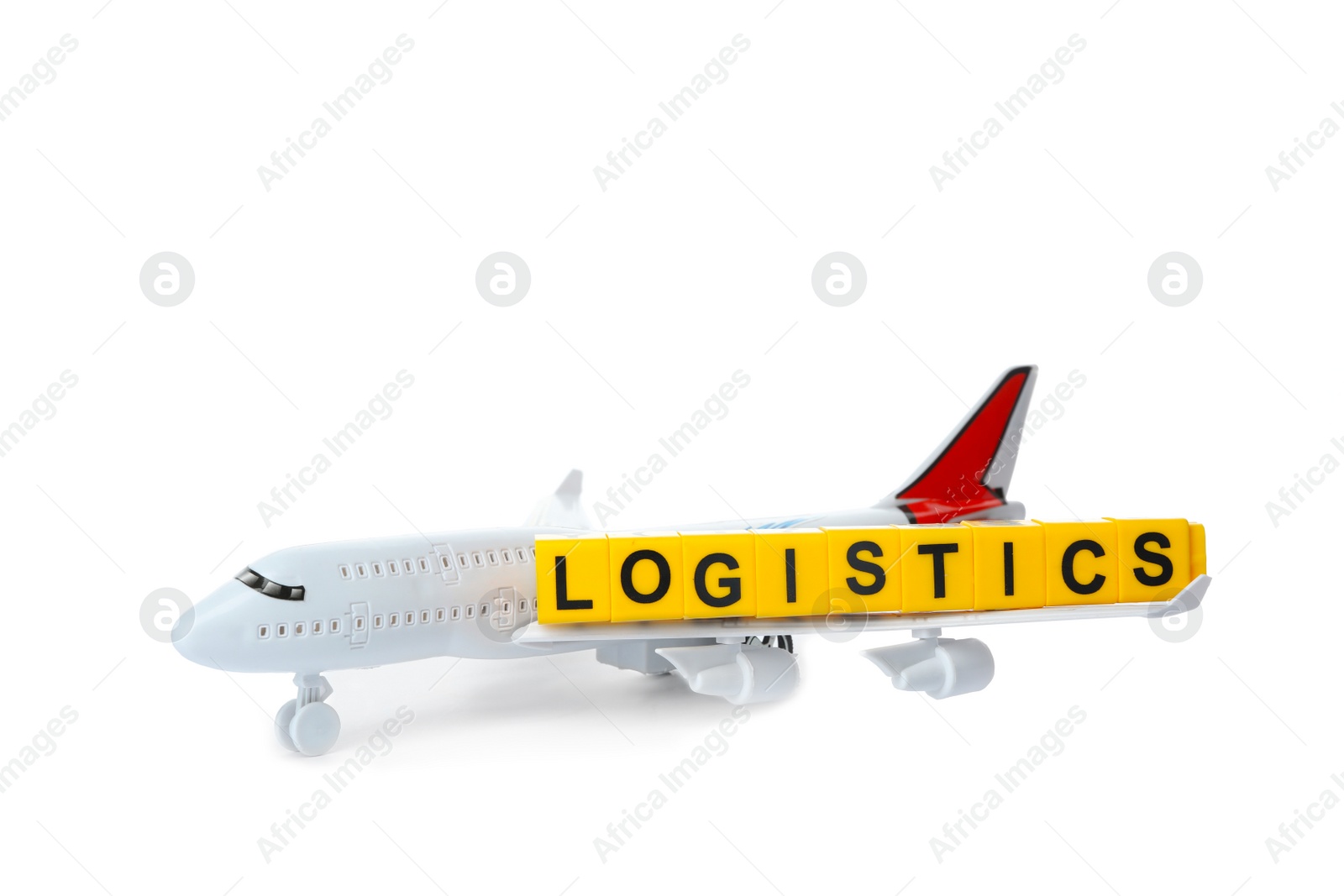 Photo of Toy plane and word LOGISTICS isolated on white. Wholesale concept
