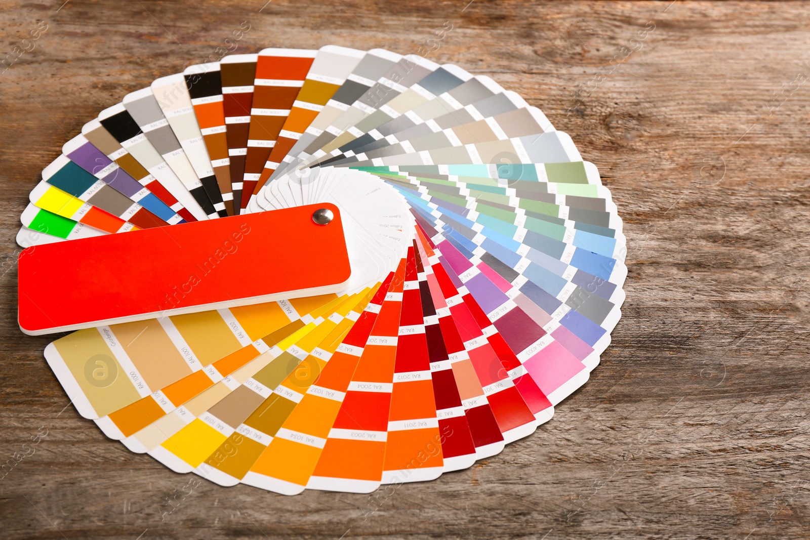 Photo of Color palette samples on wooden background