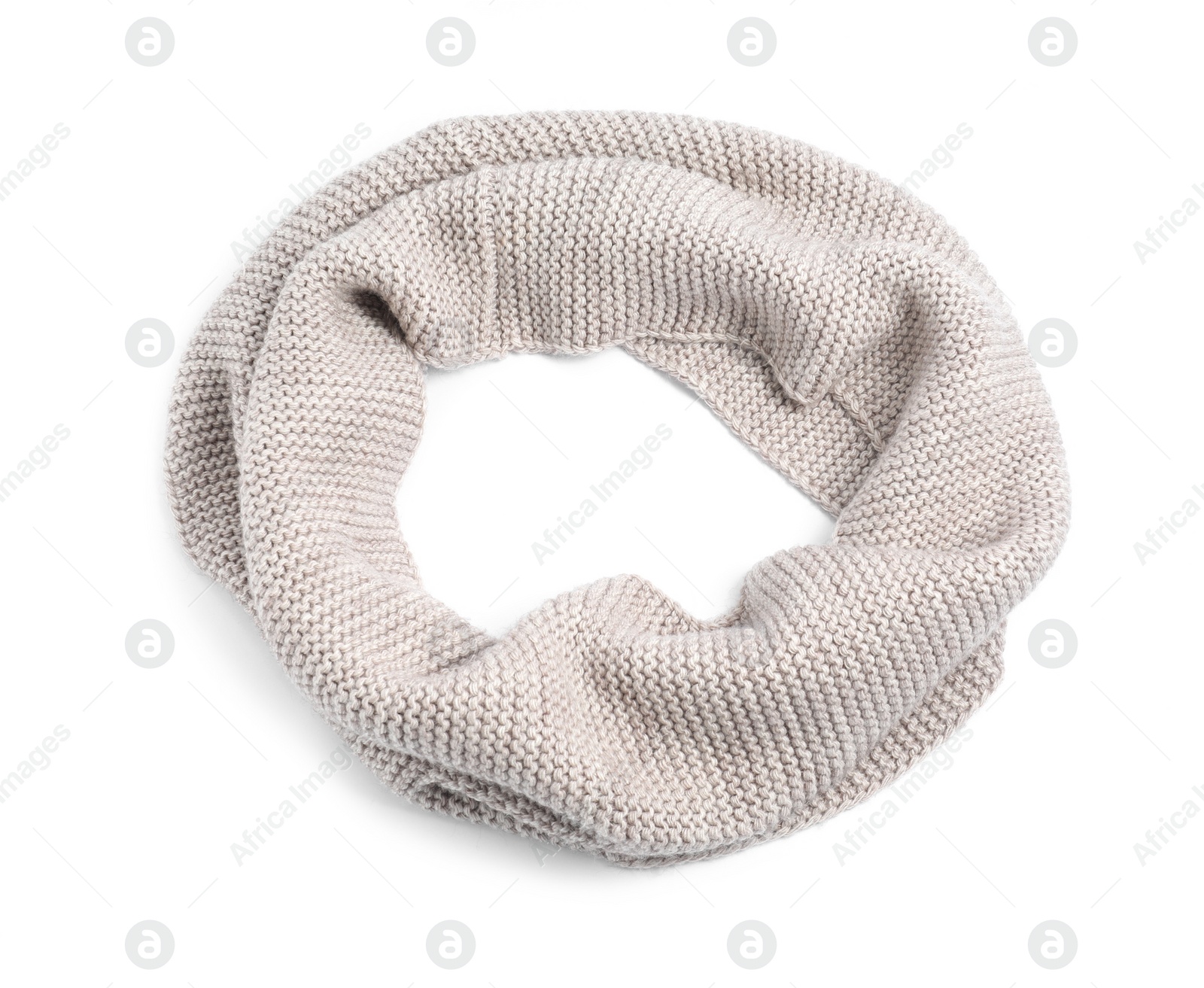 Photo of One beige knitted scarf on white background, top view