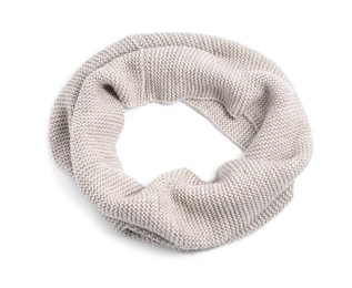 One beige knitted scarf on white background, top view