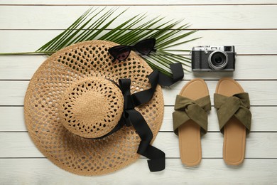 Photo of Flat lay composition with beach objects on white wooden background