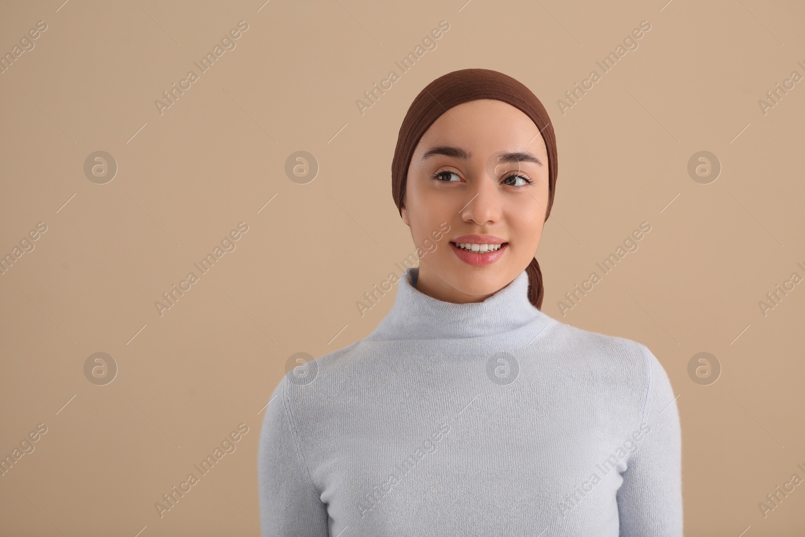 Photo of Smiling woman with cancer on beige background. Space for text