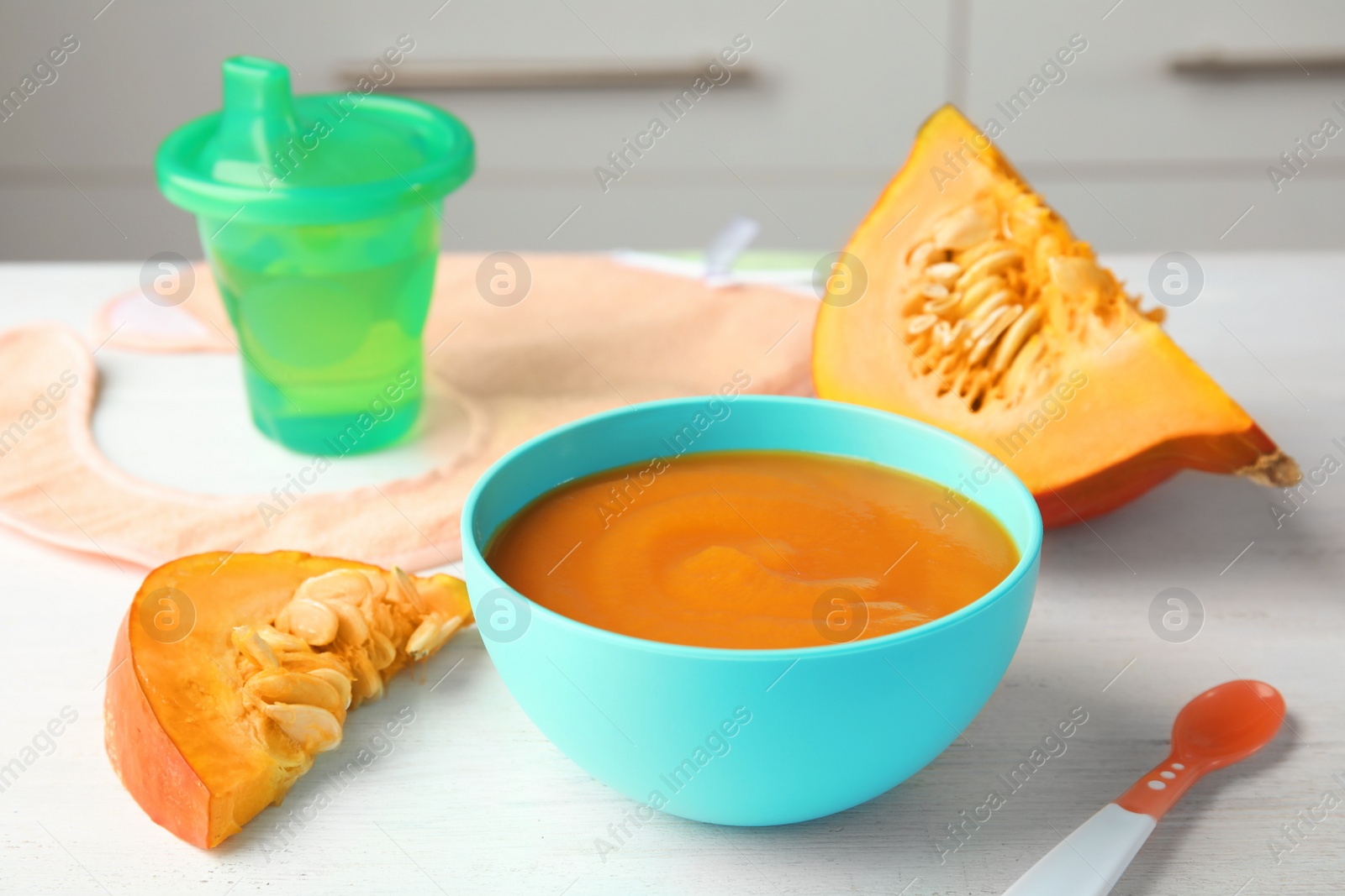 Photo of Bowl of healthy baby food on light table