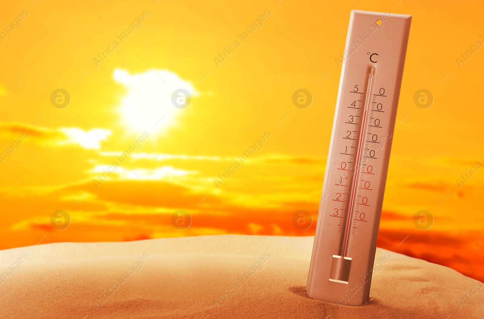 Image of Weather thermometer with high temperature outdoors on hot sunny day. Heat stroke warning