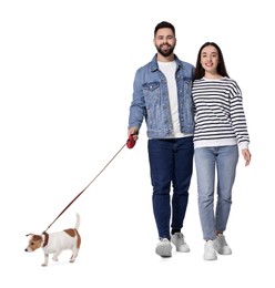 Happy couple walking with dog on white background