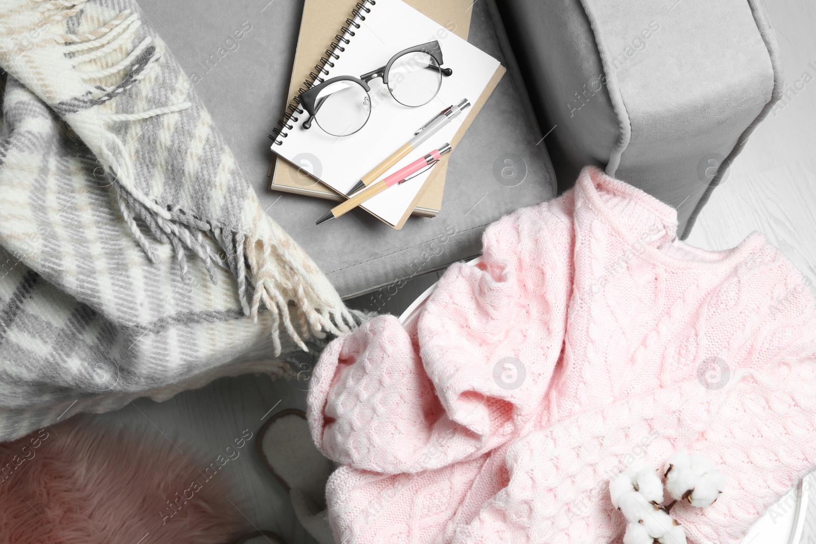 Photo of Pink sweater on table at home, flat lay