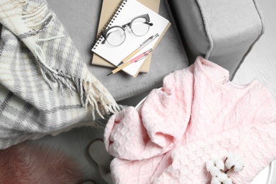 Photo of Pink sweater on table at home, flat lay