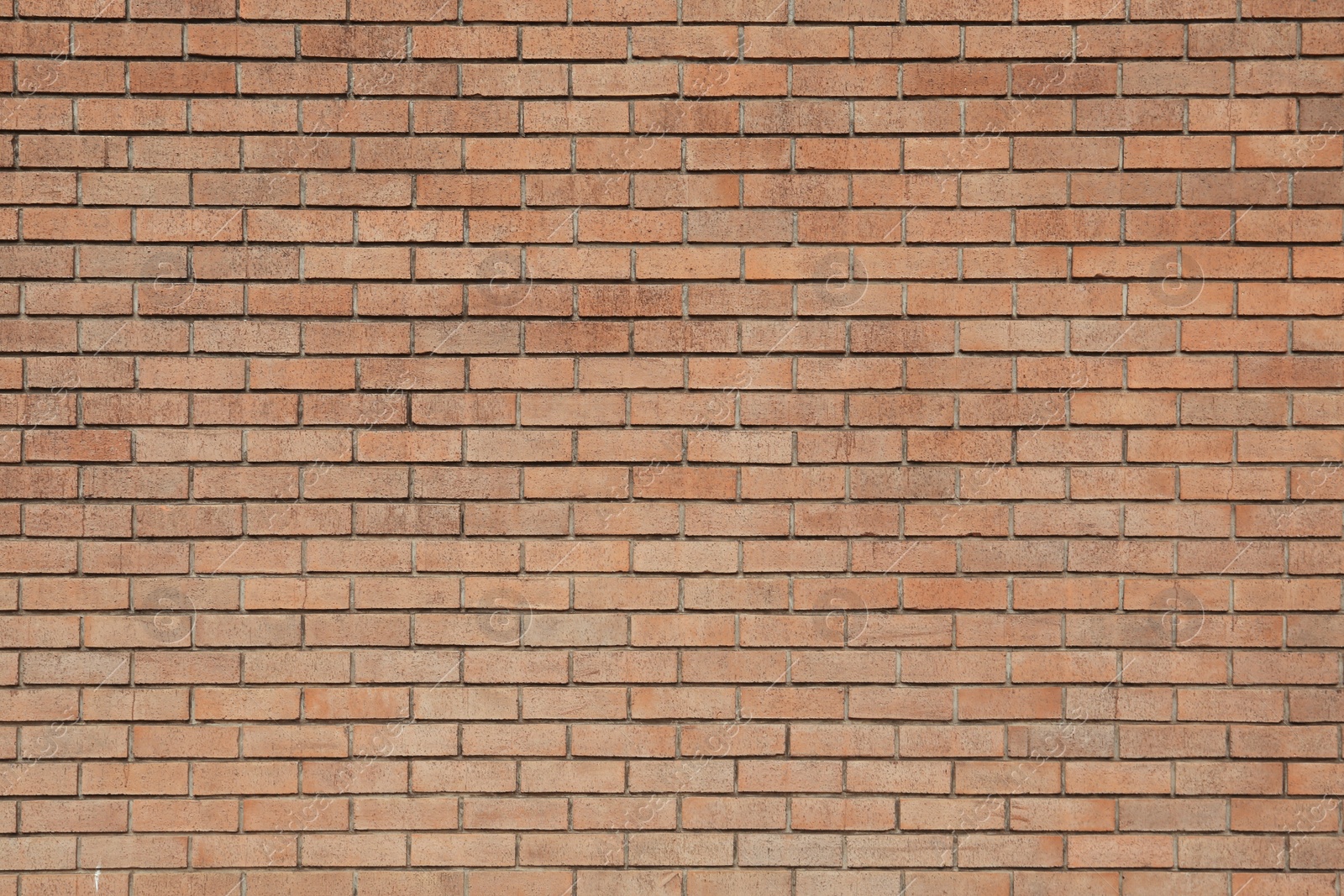 Photo of Texture of brown brick wall as background