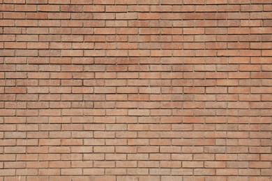 Photo of Texture of brown brick wall as background