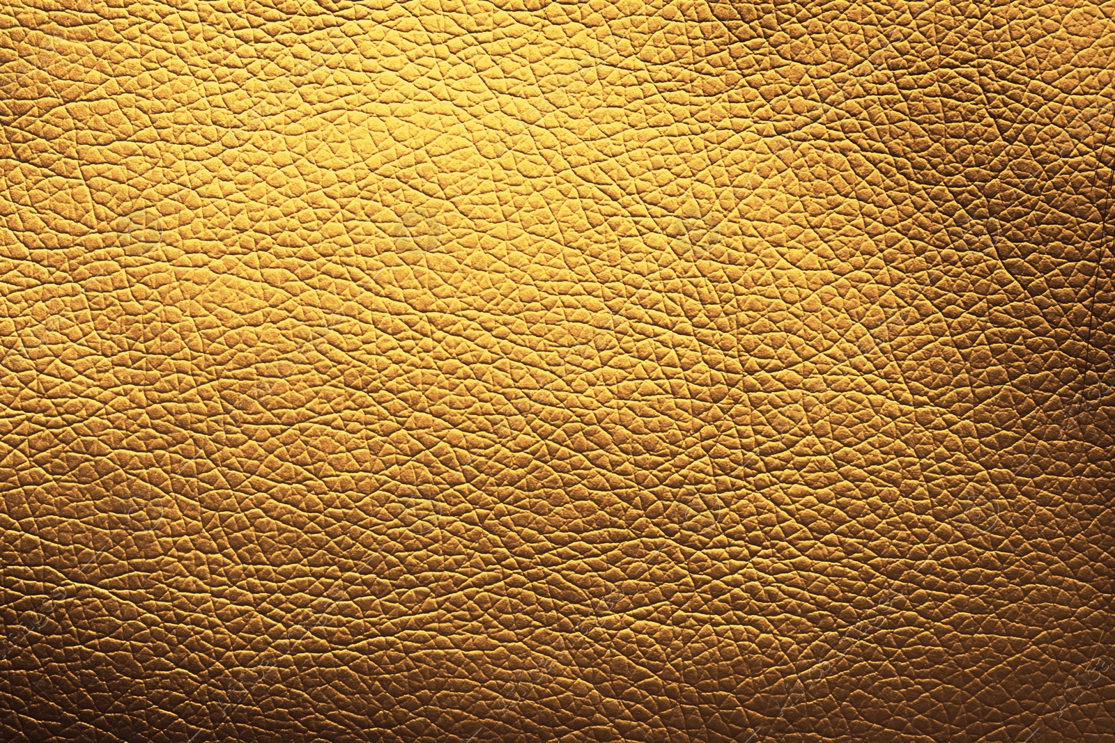 Image of Golden textured surface as background, closeup view