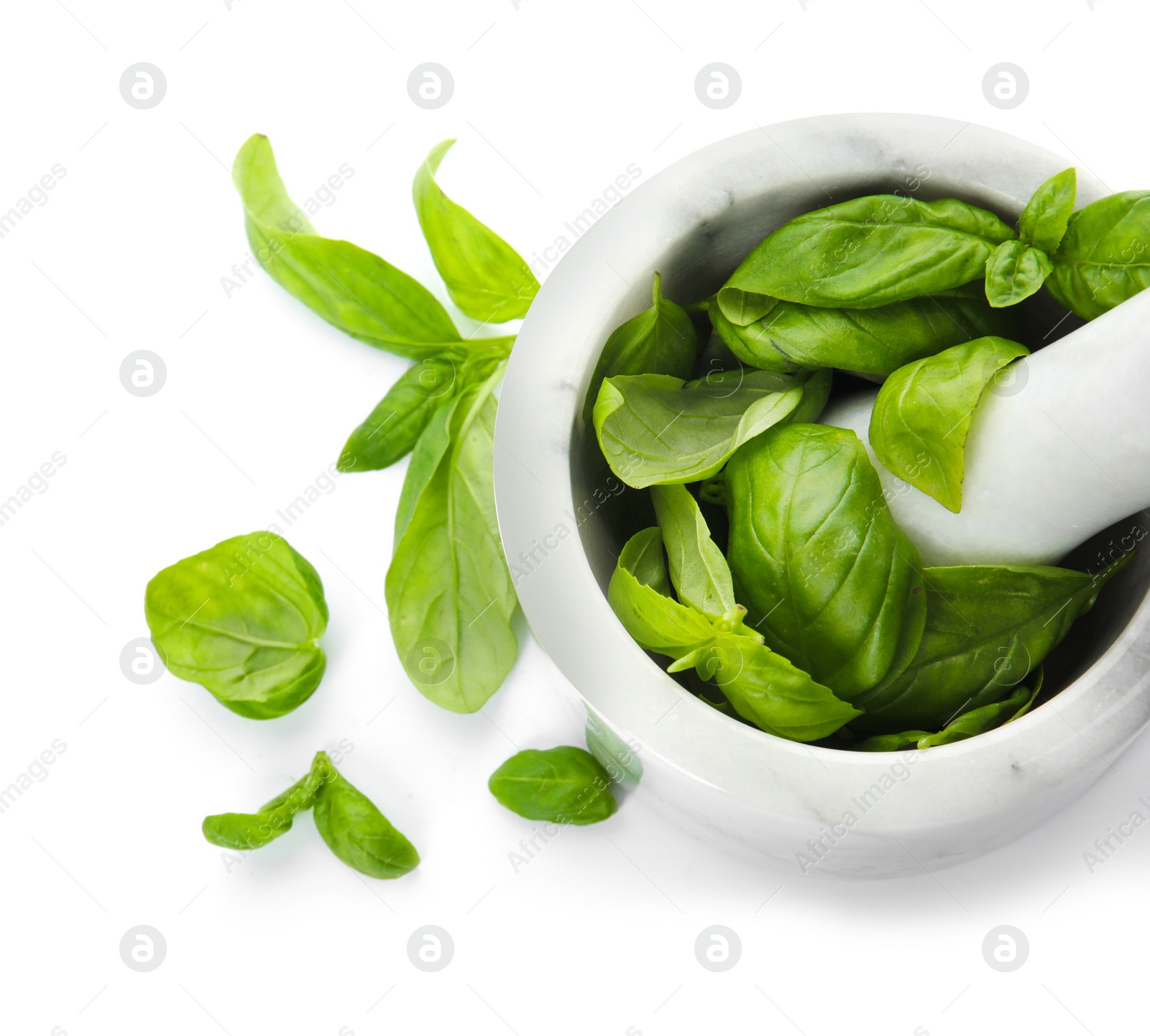 Photo of Mortar with fresh green basil leaves on white background, top view