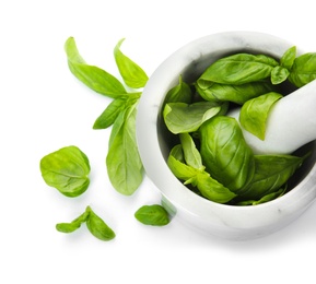 Photo of Mortar with fresh green basil leaves on white background, top view