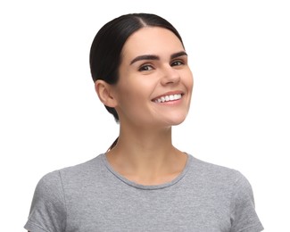 Young woman with clean teeth smiling on white background