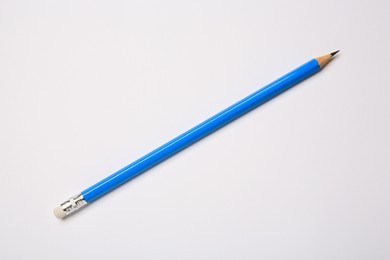 Photo of Sharp graphite pencil on white background, top view