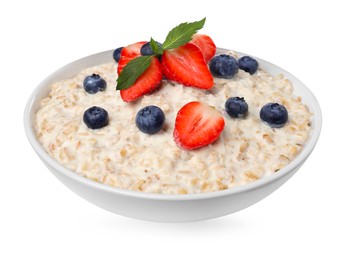 Photo of Tasty boiled oatmeal with berries in bowl isolated on white