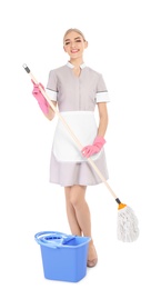 Young chambermaid with mop and bucket on white background