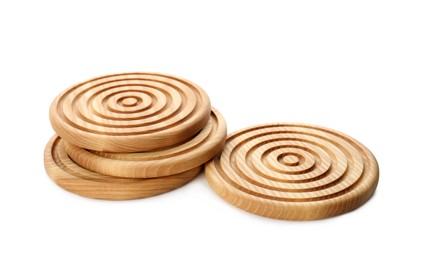 Stylish wooden cup coasters on white background